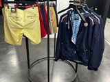 a display of clothes on a rack in a clothing store