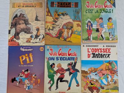 Plusieurs bandes dessinées pour enfants sont alignées sur une surface blanche