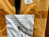 a sign on the back of a chair in a store