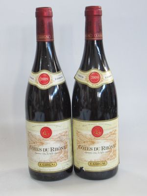 two bottles of wine sitting next to each other on a table