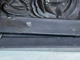 a black box with a carving of a man on it