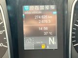 a car dashboard with a digital display on it