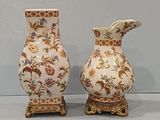 two vases that are sitting next to each other on a table