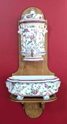 a wall mounted shelf with a bowl and a bowl on it