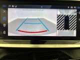 a picture of a car ' s rear view mirror showing a basketball court