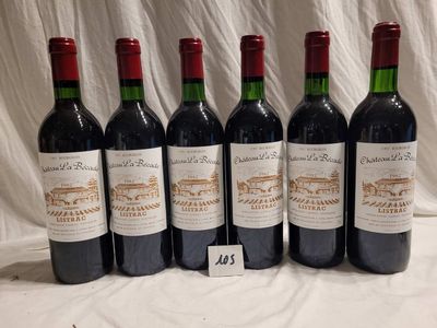six bottles of wine are lined up on a table