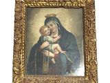 an old painting of a woman holding a child in her arms