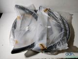 two tennis racquets wrapped in plastic on a table