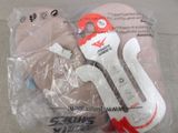 a pair of scissors in a plastic bag on the floor