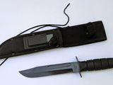 a knife that is laying next to a pocket knife