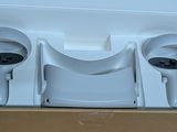 a box with two wii controllers in it on a table
