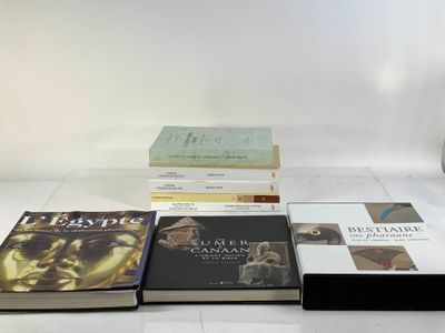 several books sitting on top of each other on a table