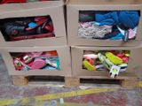 two boxes with shoes in them sitting on a pallet