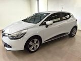 a white car is parked in a large room