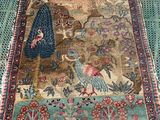 an image of a rug on a wooden floor with a cat on it
