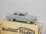 a toy car sitting on top of a box on a table