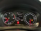 a close up of a car dashboard with various gauges