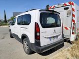 a white van that is parked on the side of the road