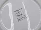 an image of a white plate with a black and white design on it