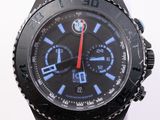 a black watch with a red second hand and a blue second hand