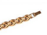 an image of a gold chain bracelet on a white background
