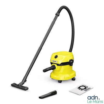 a close up of a yellow vacuum cleaner with a black hose