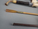 several different types of pipes are lined up on a table