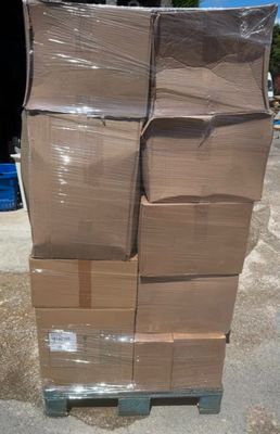 a large stack of boxes sitting on top of a pallet