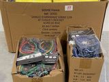 several boxes of assorted items are sitting on the floor