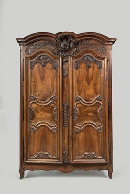 an antique wooden armoire with carvings and carvings on the doors