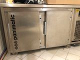 a stainless steel counter with a microwave on it