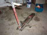 a scooter that is sitting on the floor in the garage