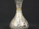 an antique silver vase on a black background with a black background