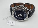 an image of a wrist watch with a leather band and a tag