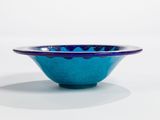 bowl with blue glaze glaze on a white background