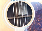 a close up of a guitar with a label on it