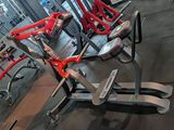 a gym with a row of exercise equipment in it