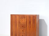 a close up of a wooden cabinet on a white surface