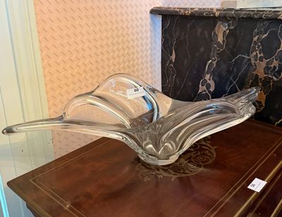 a glass bowl sitting on top of a wooden table