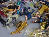 a lot of toy figurines that are on a table