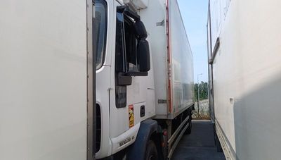 a truck that is parked next to a building