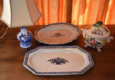 two trays and a lamp on a wooden table