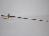 a sword that is sitting on a white surface