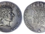 a close up of a coin with a crown on top of it