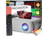 an image of a projector with a remote next to it