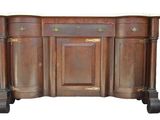 une photo d'une commode en bois avec un plateau en marbre et des tiroirs