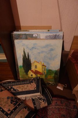 a picture of a painting on the floor next to a pile of pillows