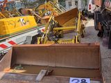 a lot of construction equipment that are sitting on the ground