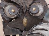 a metal sculpture of an owl made out of scrap metal