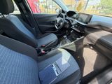 the interior of a car with blue seats and a steering wheel